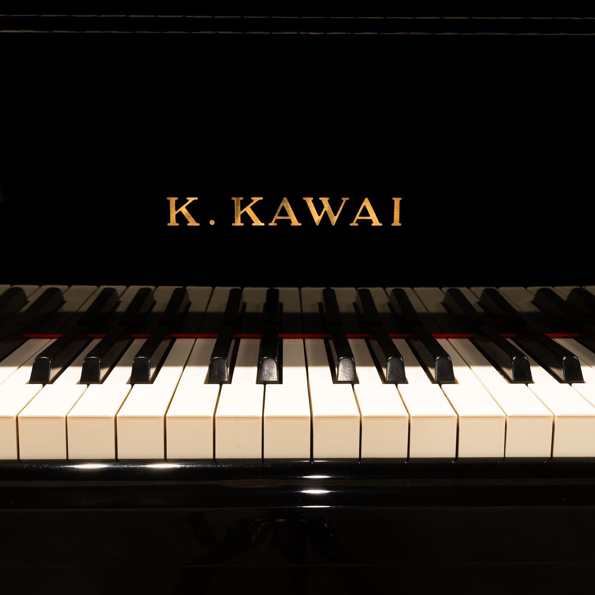 Image 4 of 2004 Kawai Grand RX-2 / 5'10" with QRS Self Playing System at Brigham Larson Pianos piano showroom sales floor.