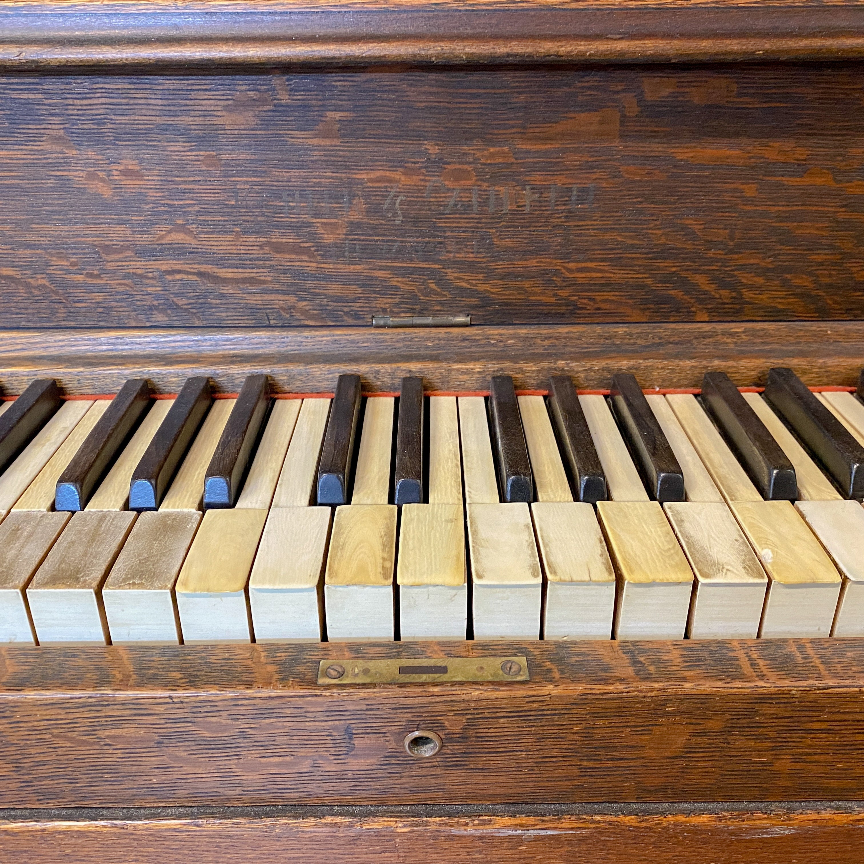 Old before piano keys Brigham Larson at Brigham Larson Pianos showcasing Kohler and Campbell upright heirloom piano rebuild and refinishing to like new condition for sentimental family purposes for next generation of piano lovers at Brigham Larson Pianos Family Heirloom Piano Restoration Shop.