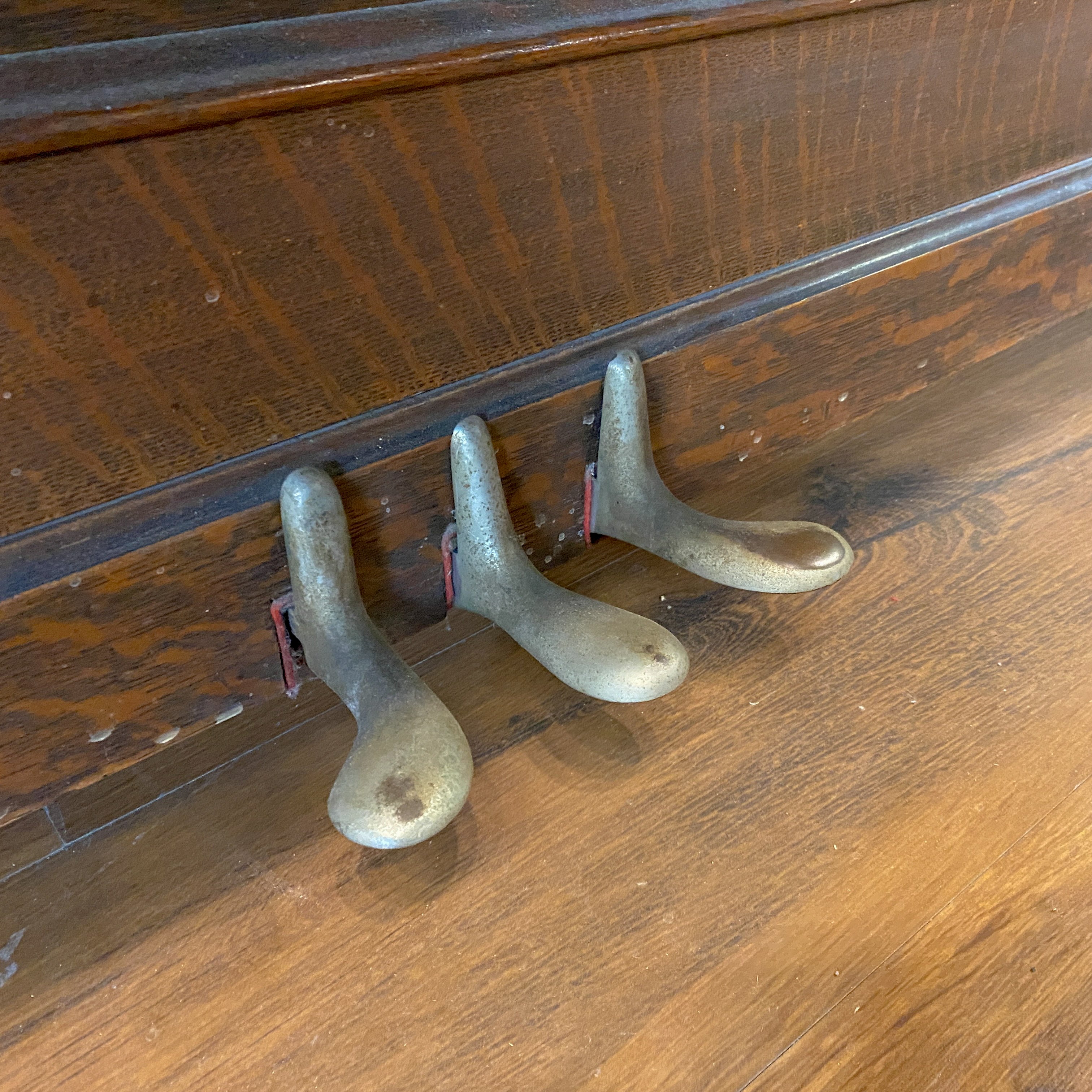 Piano pedals before restoration. Brigham Larson at Brigham Larson Pianos showcasing Kohler and Campbell upright heirloom piano rebuild and refinishing to like new condition for sentimental family purposes for next generation of piano lovers at Brigham Larson Pianos Family Heirloom Piano Restoration Shop.