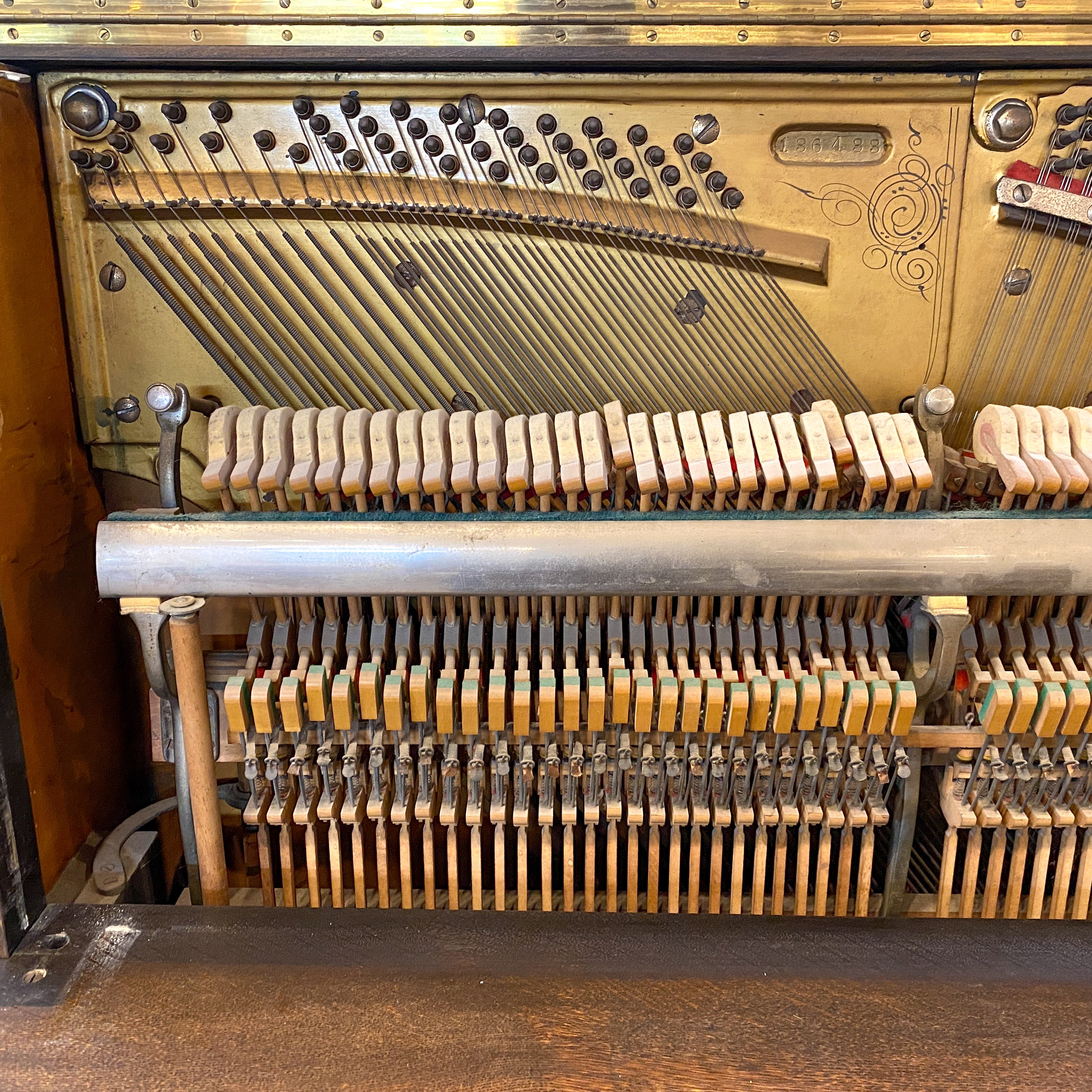 Piano Hammers and action before restoration. Brigham Larson at Brigham Larson Pianos showcasing Kohler and Campbell upright heirloom piano rebuild and refinishing to like new condition for sentimental family purposes for next generation of piano lovers at Brigham Larson Pianos Family Heirloom Piano Restoration Shop.