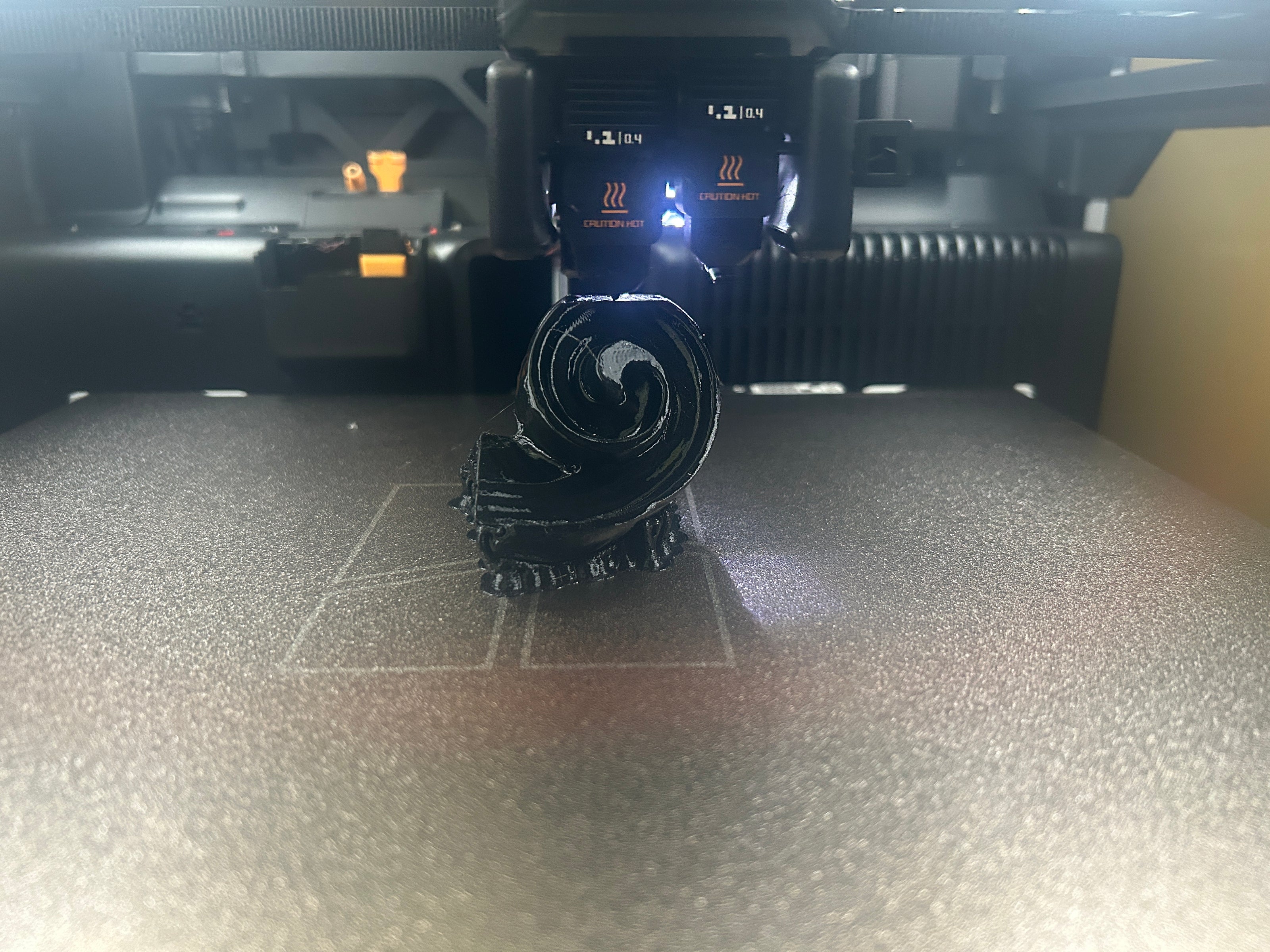 3D printer in operation with filament on a bed at the Brigham Larson Pianos family heirloom piano restoration shop in Orem, UT.