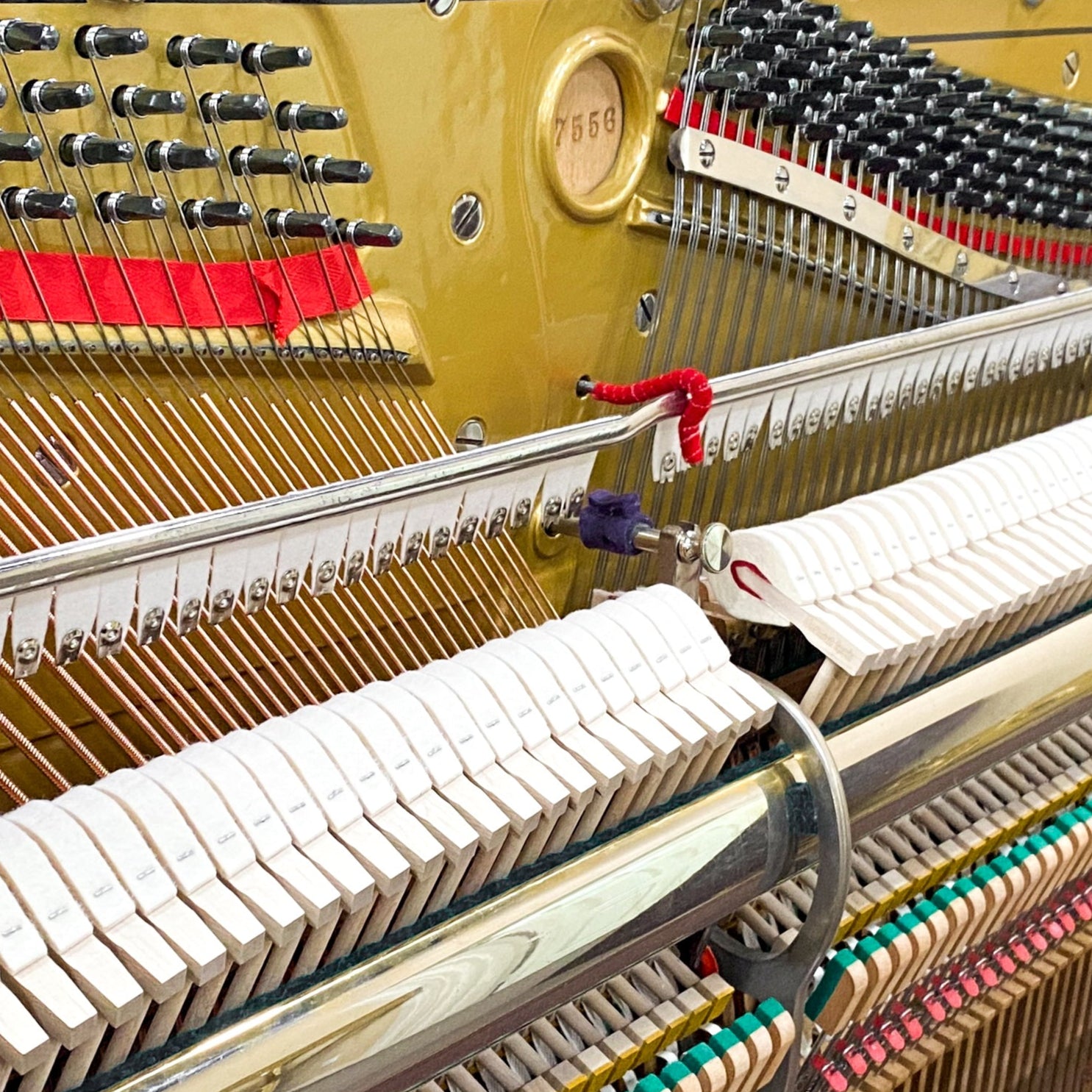After piano restoration piano hammers, piano action, piano plate, piano strings, piano tuning pins, photo of after the Schubert upright heirloom piano was restored and rebuilt and refinished to like new condition.