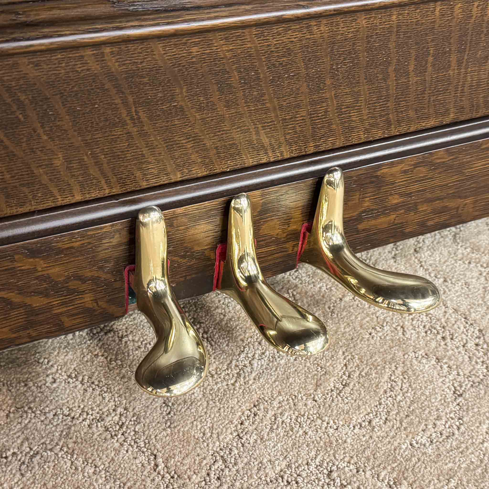 Piano pedals after restoration. Brigham Larson at Brigham Larson Pianos showcasing Kohler and Campbell upright heirloom piano rebuild and refinishing to like new condition for sentimental family purposes for next generation of piano lovers at Brigham Larson Pianos Family Heirloom Piano Restoration Shop.