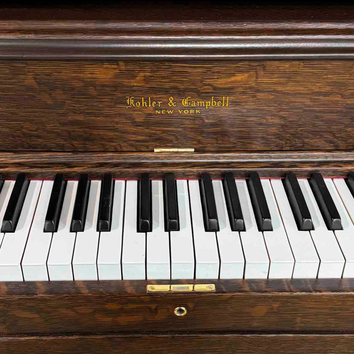 Beautiful piano keys brand new condition. Brigham Larson at Brigham Larson Pianos showcasing Kohler and Campbell upright heirloom piano rebuild and refinishing to like new condition for sentimental family purposes for next generation of piano lovers at Brigham Larson Pianos Family Heirloom Piano Restoration Shop.