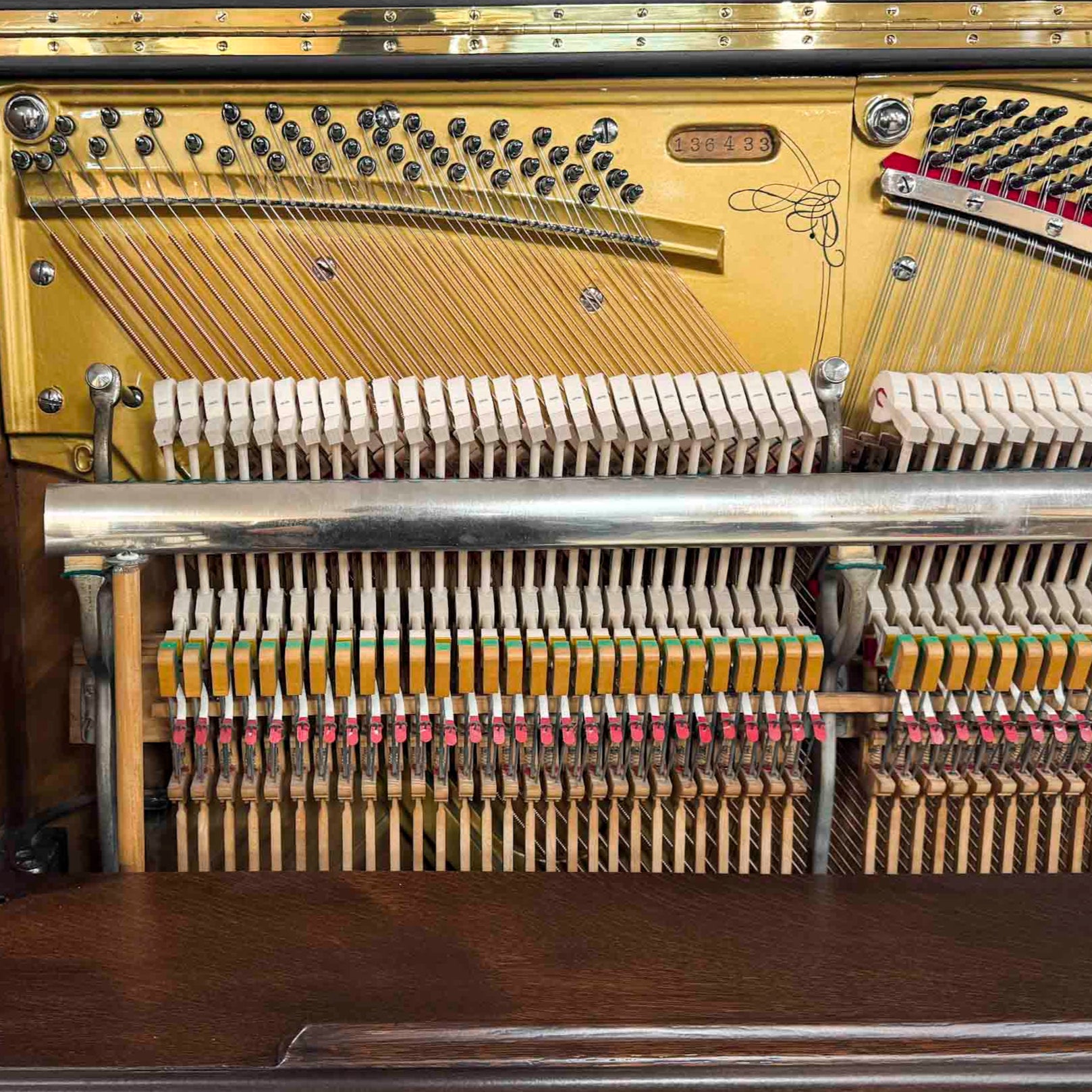 Piano hammers and action after restoration. Brigham Larson at Brigham Larson Pianos showcasing Kohler and Campbell upright heirloom piano rebuild and refinishing to like new condition for sentimental family purposes for next generation of piano lovers at Brigham Larson Pianos Family Heirloom Piano Restoration Shop.