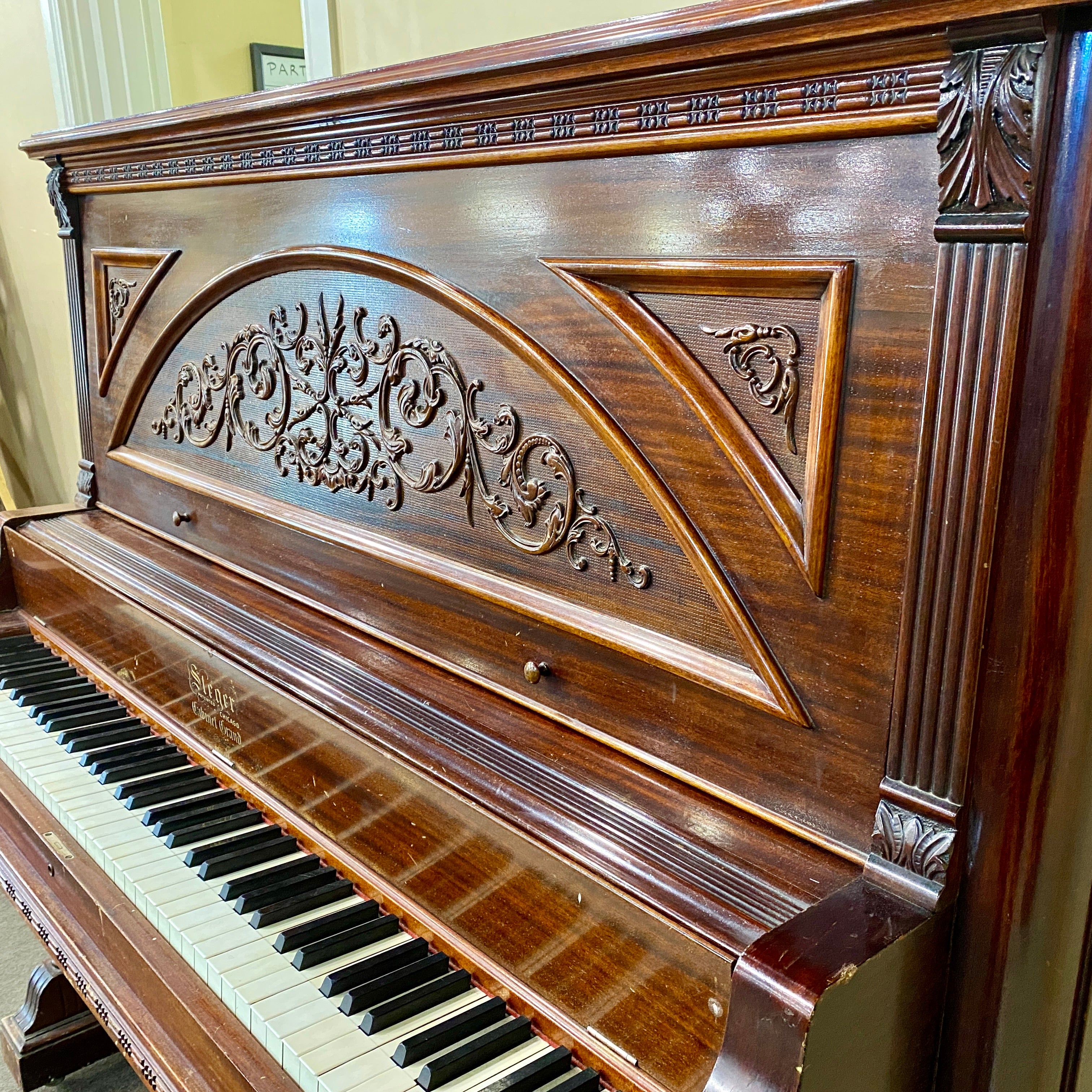 Before restoration piano ornate cabinetry for Fully restored, rebuilt, refinished, like new restored sentimental family heirloom Steger upright piano. Gorgeous piano refinishing work! Ornate cabinetry. 