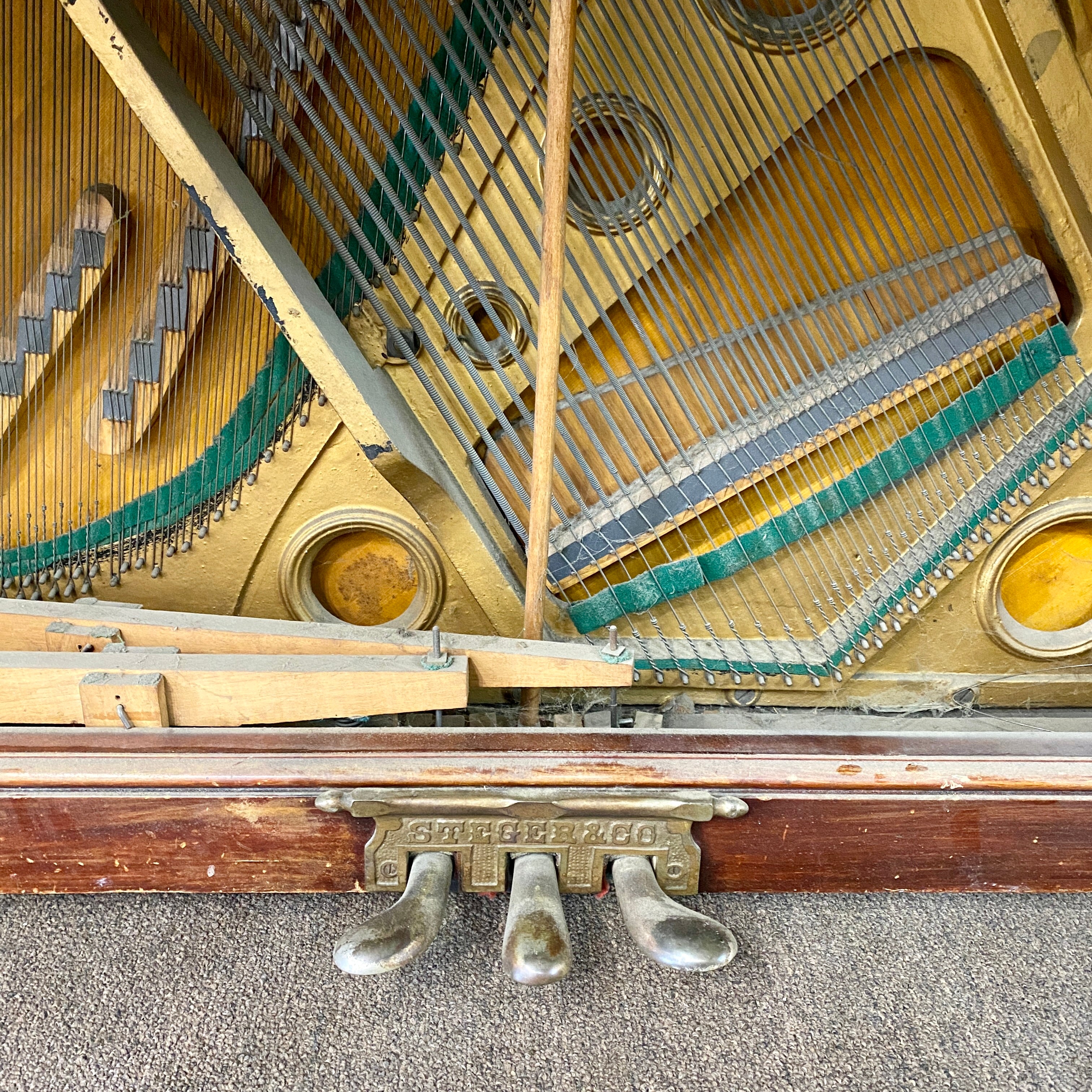 Before restoration and metal hardware replating on piano pedals for Fully restored, rebuilt, refinished, like new restored sentimental family heirloom Steger upright piano. Gorgeous piano refinishing work! Ornate cabinetry. 