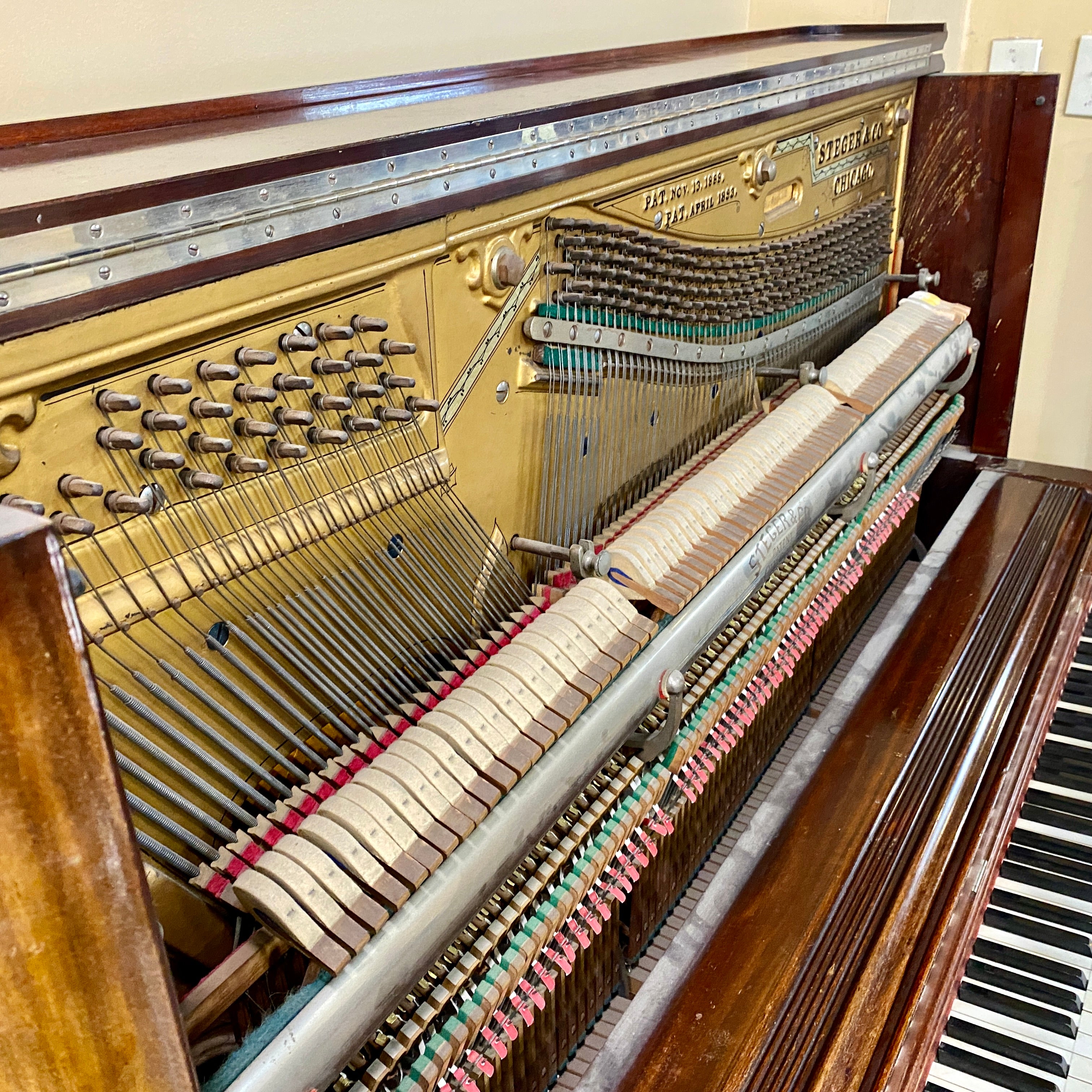 Before piano action on Fully restored, rebuilt, refinished, like new restored sentimental family heirloom Steger upright piano. Gorgeous piano refinishing work! Ornate cabinetry. 