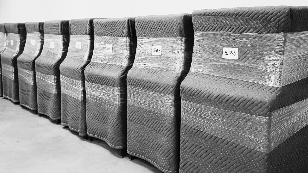 Upright Pianos lined up in Piano Storage at Brigham Larson Pianos.